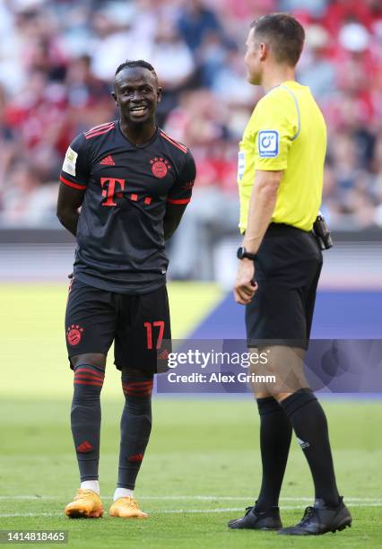 Sadio Mane of FC Bayern Muenchen reacts as Match Referee, Harm Osmers awaits a VAR review before disallowing their goal during the Bundesliga match...