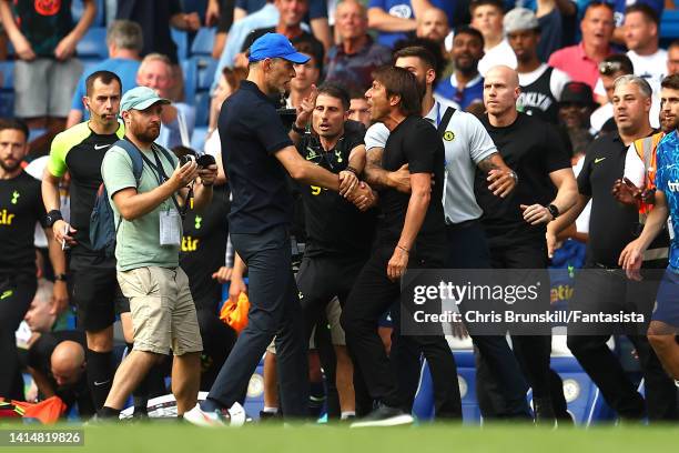 Chelsea manager Thomas Tuchel clashes with Tottenham Hotspur manager Antonio Conte at full-time following the Premier League match between Chelsea FC...