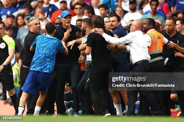 Chelsea manager Thomas Tuchel clashes with Tottenham Hotspur manager Antonio Conte at full-time following the Premier League match between Chelsea FC...