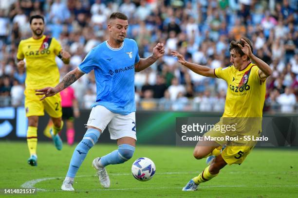 Sergej Milinkovic Savic of SS Lazio compete for the ball with Andrea Cambiaso of Bologna FC during the Serie A match between SS Lazio and Bologna FC...