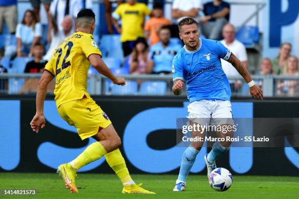 Ciro Immobile of SS Lazio compete for the ball with Charala,pos Lykogiannis of Bologna FC during the Serie A match between SS Lazio and Bologna FC at...