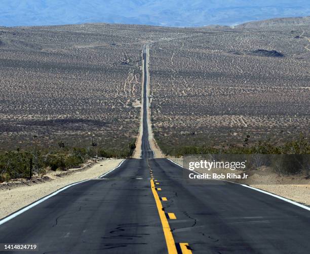 Vast, empty desert road in the remote Mojave Desert, August 15, 2015 near Ridgecrest, California.