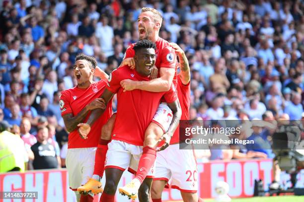 Taiwo Awoniyi of Notts Forest celebrates scoring the first goal with team mates during the Premier League match between Nottingham Forest and West...