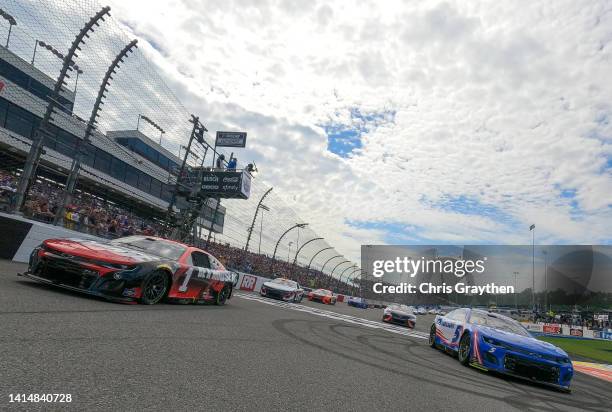 Kyle Larson, driver of the HendrickCars.com Chevrolet, and Ross Chastain, driver of the Moose Fraternity Chevrolet, lead the field on a pace lap...