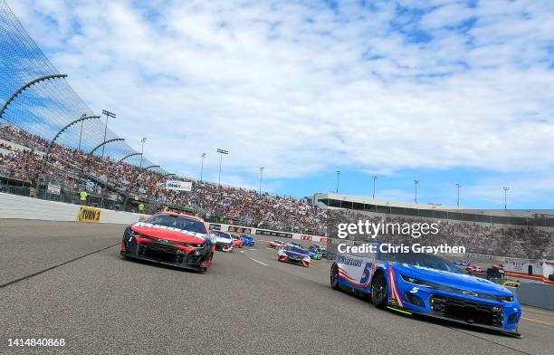 Kyle Larson, driver of the HendrickCars.com Chevrolet, and Ross Chastain, driver of the Moose Fraternity Chevrolet, lead the field on a pace lap...