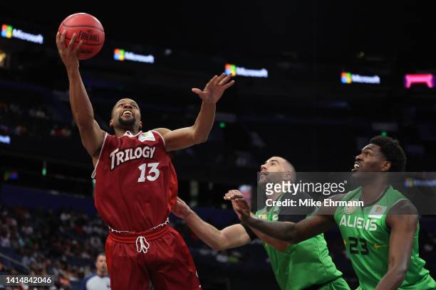 Isaiah Briscoe of the Trilogy goes up for a shot in front of Deshawn Stephens of the Aliens during the BIG3 Playoffs on August 14, 2022 at Amalie...