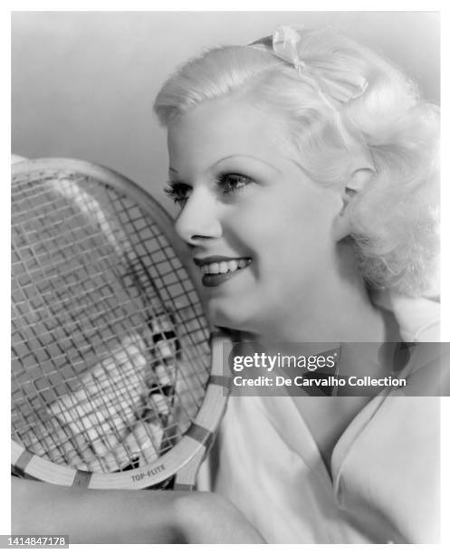 Actress Jean Harlow holds a tennis racquet in a publicity shot from the mid 1930’s, United States.