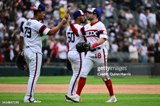 Pollock and Jose Abreu of the Chicago White Sox celebrate the 5-3 win against the Detroit Tigers at Guaranteed Rate Field on August 14, 2022 in...