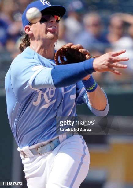 Bobby Witt Jr. #7 of the Kansas City Royals throws to first as he tries to get the force out on Freddie Freeman of the Los Angeles Dodgers in the...