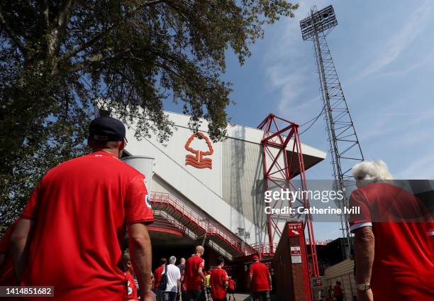 Fans make their way to the stadium ahead of the Premier League match between Nottingham Forest and West Ham United at City Ground on August 14, 2022...