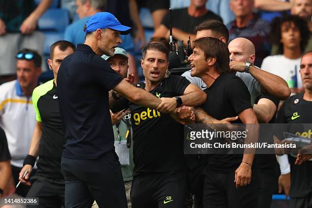 Chelsea manager Thomas Tuchel clashes with Tottenham Hotspur manager Antonio Conte at full-time following the Premier League match between Chelsea FC...