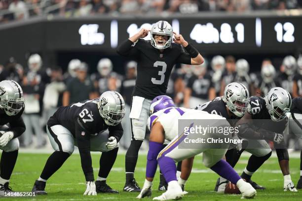 Quarterback Jarrett Stidham of the Las Vegas Raiders signals at the line of scrimmage during the first half of a preseason game against the Minnesota...