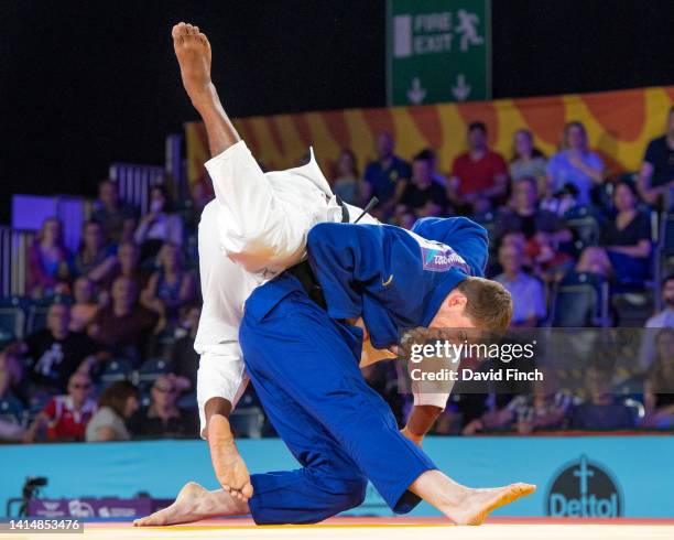 International medallist, Rhys Thompson of England throws Tevita Takayawa of Fiji for an ippon to win the bronze medal during the Day 6 finals session...