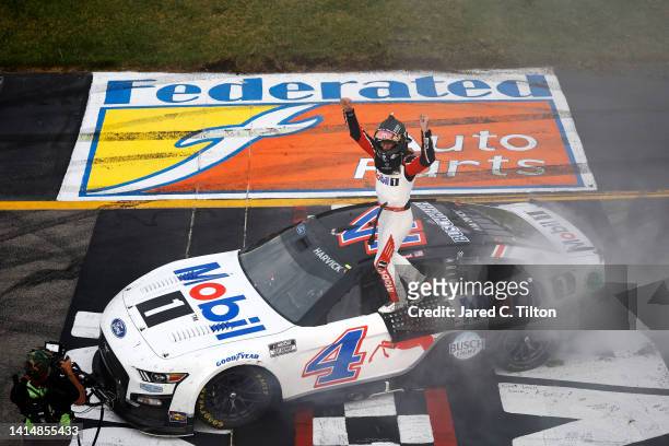 Kevin Harvick, driver of the Mobil 1 Ford, celebrates after winning the NASCAR Cup Series Federated Auto Parts 400 at Richmond Raceway on August 14,...
