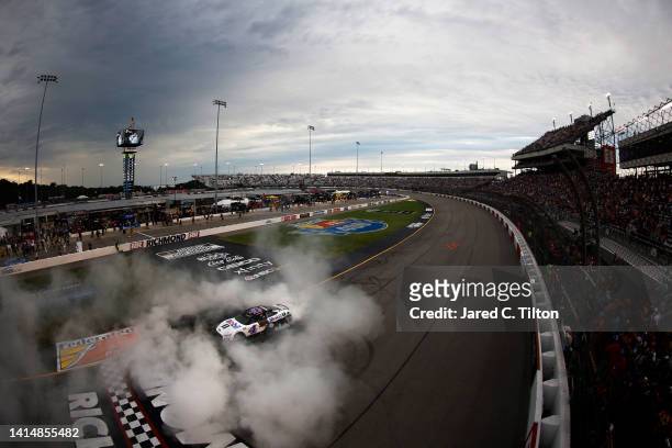 Kevin Harvick, driver of the Mobil 1 Ford, celebrates with a burnout after winning the NASCAR Cup Series Federated Auto Parts 400 at Richmond Raceway...