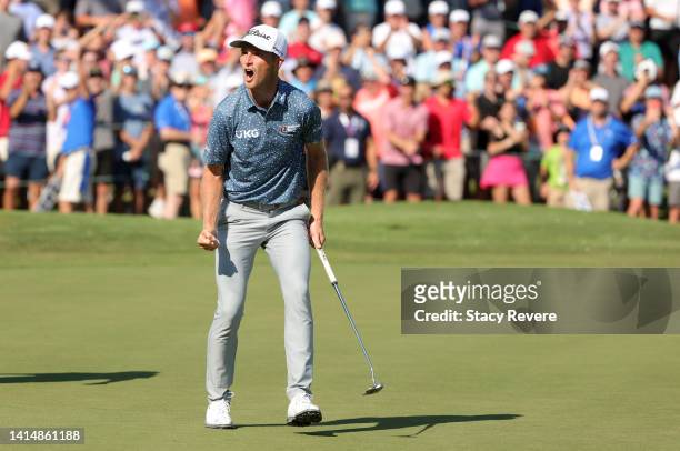 Will Zalatoris of the United States reacts on the 18th green in regulation after putting in to force a playoff against Sepp Straka of Austria during...