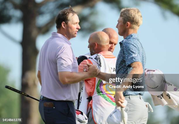 Will Zalatoris of the United States shakes hands with Sepp Straka of Austria after putting in to win on the third playoff hole on the 11th green...