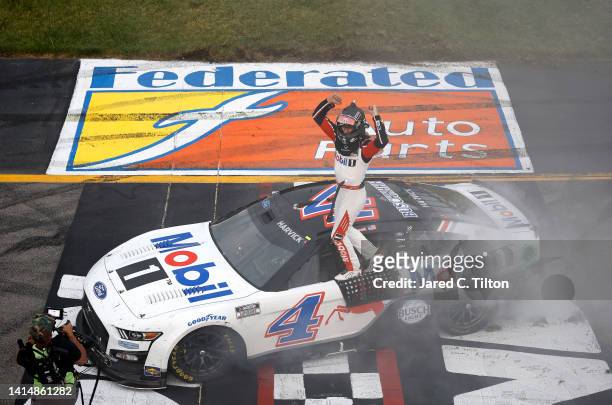 Kevin Harvick, driver of the Mobil 1 Ford, celebrates after winning the NASCAR Cup Series Federated Auto Parts 400 at Richmond Raceway on August 14,...