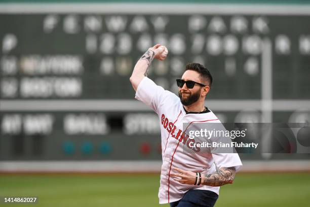 DraftKings content producer, podcaster and former Barstool sports personality Jared Carrabis throws a ceremonial first pitch before a game between...