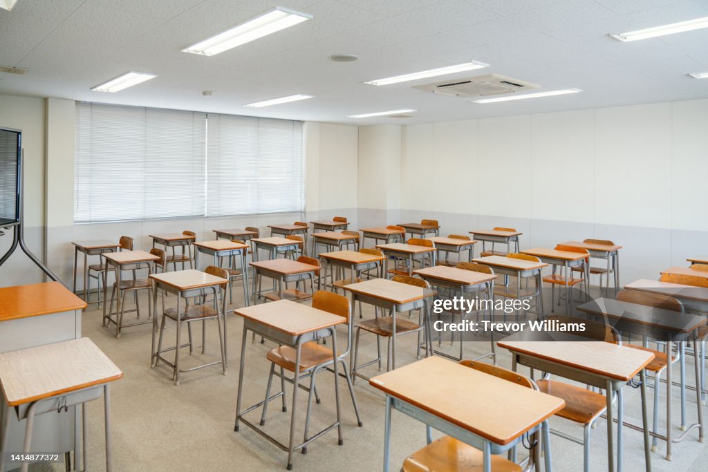 Empty classroom with rows of desks at a community college