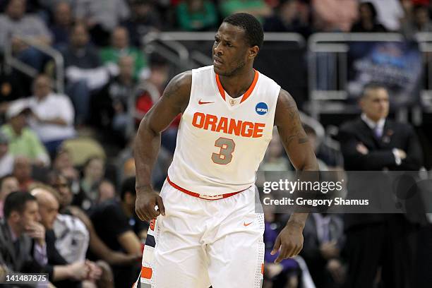 Dion Waiters of the Syracuse Orange reacts after he made a basket in the first half against the Kansas State Wildcats during the third round of the...