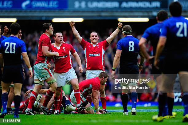 Wales prop Gethin Jenkins celebrates with team mates on the final whistle after winning the Grand Slam after the RBS Six Nations match between Wales...