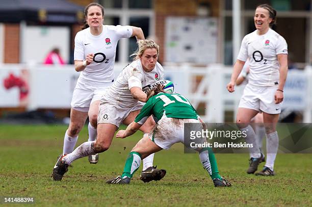Rachael Burford of England runs at Lynne Cantwell of Ireland during the Womens Six Nations match between England Women and Ireland Women at Esher...