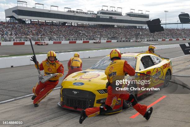 Joey Logano, driver of the Shell Pennzoil Ford, pits during the NASCAR Cup Series Federated Auto Parts 400 at Richmond Raceway on August 14, 2022 in...