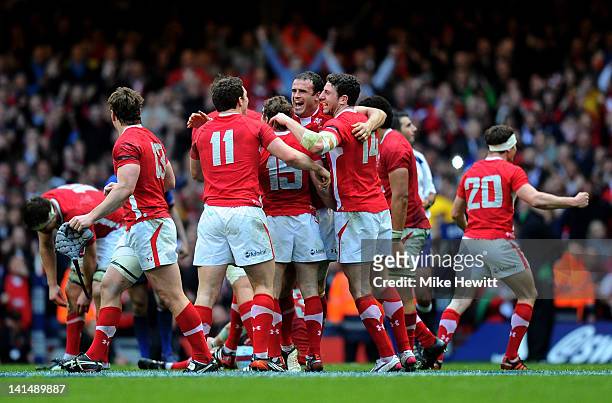The Wales players celebrate after winning the match and the Grand Slam during the RBS Six Nations Championship match between Wales and France at the...