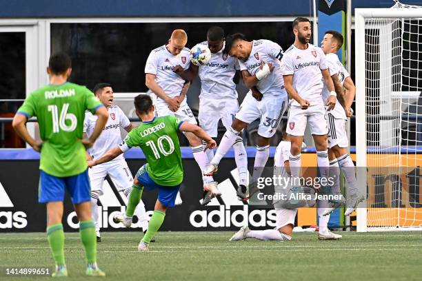 Justen Glad, Sergio Córdova, Marcelo Silva, Justin Meram, and Aaron Herrera of Real Salt Lake block Nicolás Lodeiro of Seattle Sounders kick during...