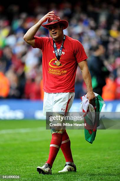 Centre Jamie Roberts of Wales celebrates following his team's Grand Slam victory during the RBS Six Nations Championship match between Wales and...