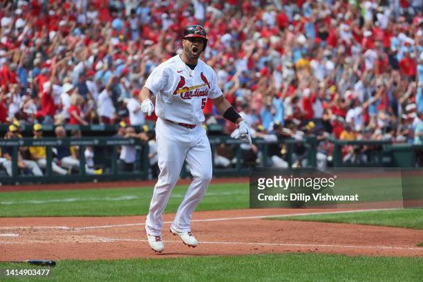 Albert Pujols of the St. Louis Cardinals celebrates after hitting his second home run of the game against the Milwaukee Brewers at Busch Stadium on...