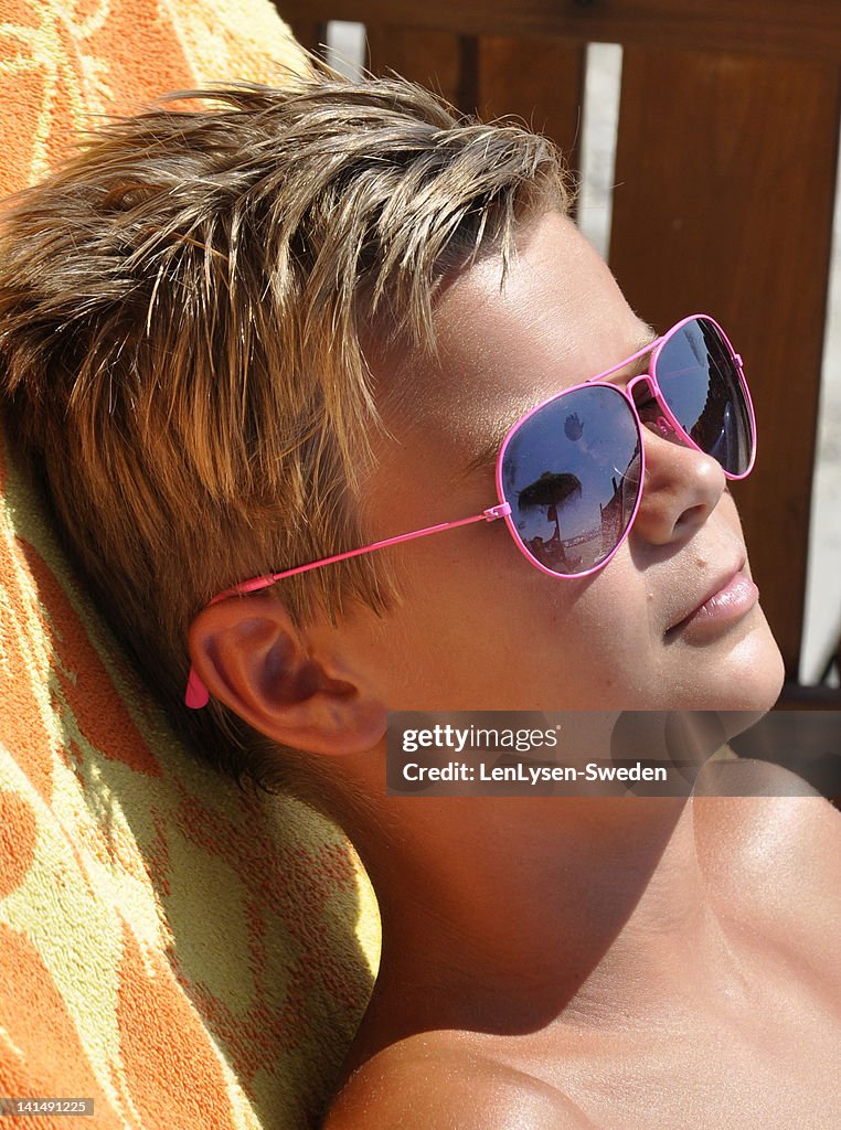 Bot Sunbaking Boy Sunbathing High-Res Stock Photo - Getty Images