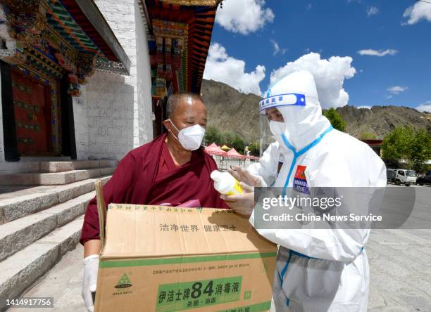 Volunteer delivers anti-epidemic supplies to Drepung Monastery on August 14, 2022 in Lhasa, Tibet Autonomous Region of China. Lhasa will extend...