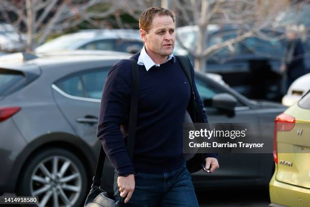 Essendon General Manager of Football, Josh Mahoney walks from the Essendon Football Club base The Hangar on August 15, 2022 in Melbourne, Australia.