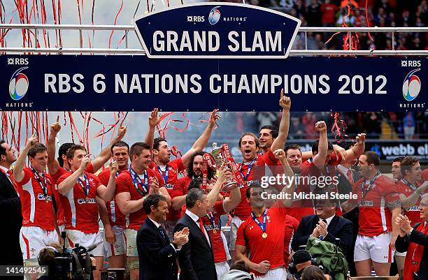 The Wales players celebrate after winning the match and the Grand Slam during the RBS Six Nations Championship match between Wales and France at the...