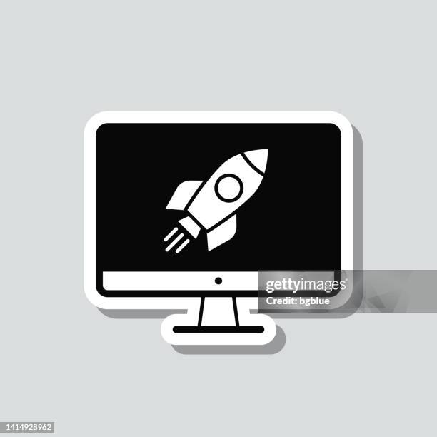 desktop computer with rocket. icon sticker on gray background - 3d rocket launch stock illustrations