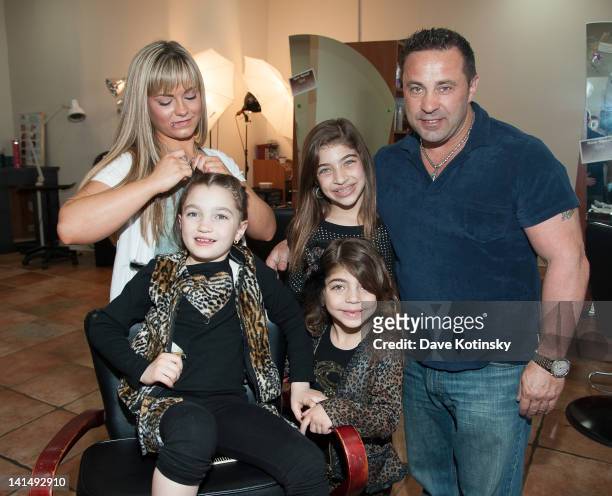Gabriella Giudice get braids in her hair beside Gia Giudice, Milania Giudice and Joe Giudice at the Kaleidoscope Hair & Body Artistry open house on...