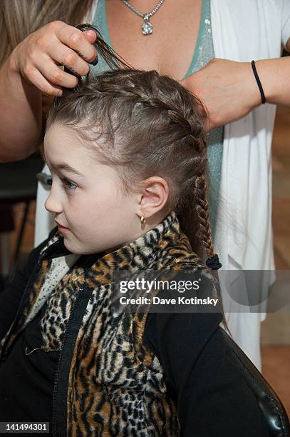 Gabriella Giudice has her hair braided at the Kaleidoscope Hair & Body Artistry open house on March 17, 2012 in Basking Ridge, New Jersey.