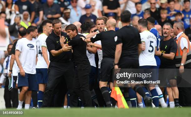 Tottenham Hotspur manager Antonio Conte is held back prior to being shown a red card after the Premier League match between Chelsea FC and Tottenham...