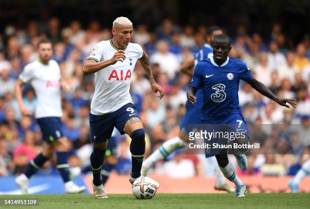 Richarlison of Tottenham Hotspur is challenged by N'Golo Kante of Chelsea during the Premier League match between Chelsea FC and Tottenham Hotspur at...