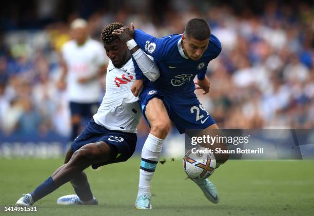 Kai Havertz of Chelsea is challenged by Emerson Royal of Tottenham Hotspur during the Premier League match between Chelsea FC and Tottenham Hotspur...