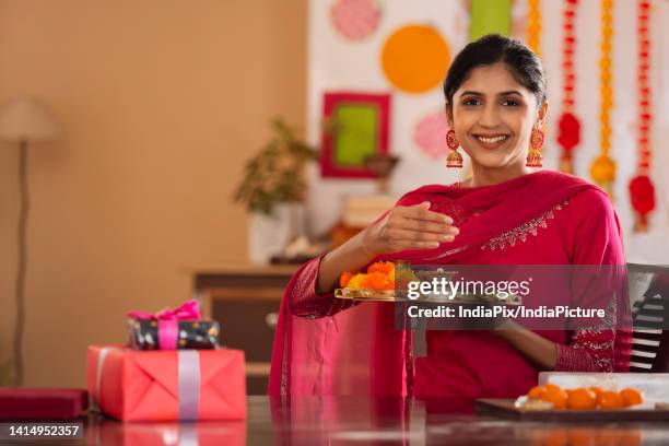 sister holding pooja plate on the occasion of raksha bandhan - raksha bandhan stock pictures, royalty-free photos & images