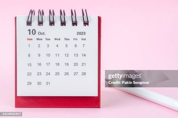 calendar desk 2023 october is the month for the organizer to plan and deadline with a white pencil against a white background. - outubro imagens e fotografias de stock