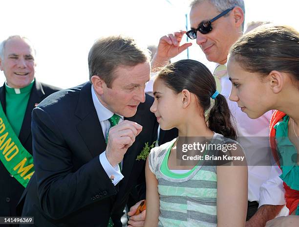 Irish Taoiseach Enda Kenny talks with Leah and Illana Emanuel , daughters of Chicago Mayor Rahm Emanuel , before they march in the city's St....