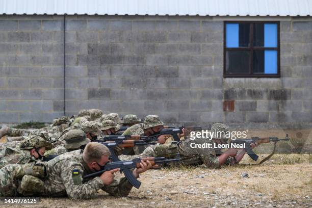 Ukrainian volunteer military recruits take part in a weapon handling exercise whilst being trained by members of the British Armed Forces at a...