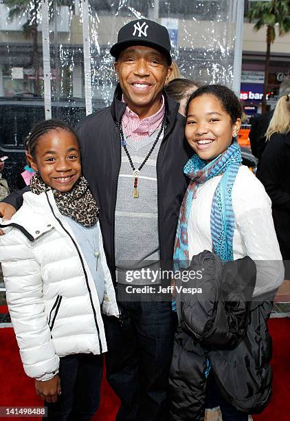 Producer Russell Simmons and daughters Aoki Lee and Ming Lee attend the "Mirror Mirror" premiere at Grauman's Chinese Theatre on March 17, 2012 in...