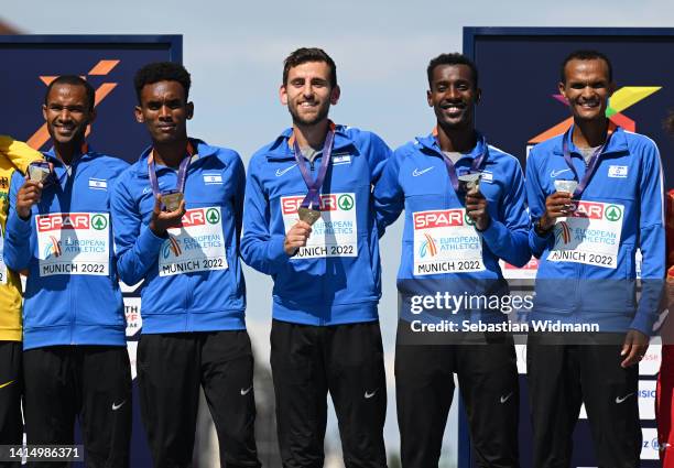 Gold medalists Maru Teferi, Gashau Ayale, Omer Ramon, Yimer Getahun and Girmaw Amare of Israel pose on the podium during the Men's Marathon Final -...