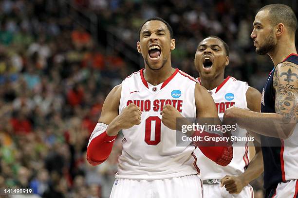 Jared Sullinger and Deshaun Thomas of the Ohio State Buckeyes reacts in the second half against Robert Sacre of the Gonzaga Bulldogs during the third...