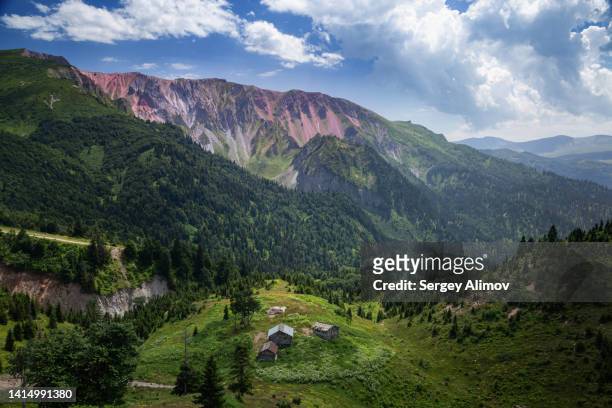 hills and valleys with countryside nearby khikhani fortress in mountainous georgia - georgia country stock pictures, royalty-free photos & images